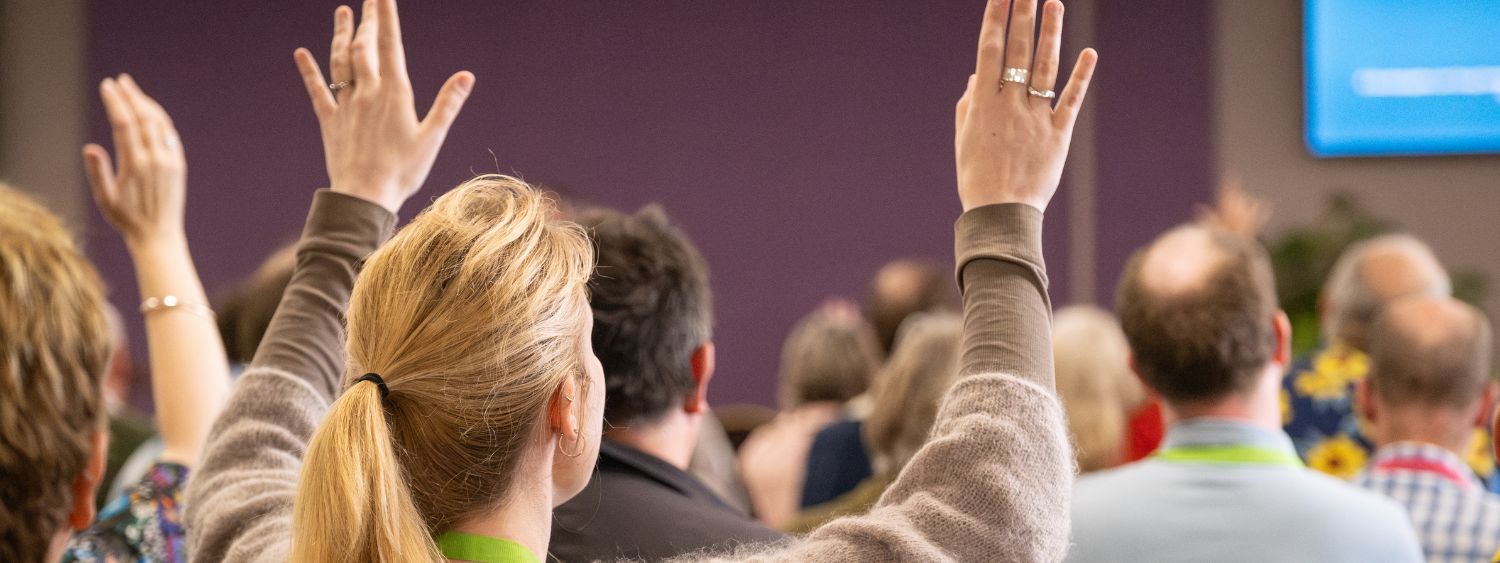 Hands are raised in worship