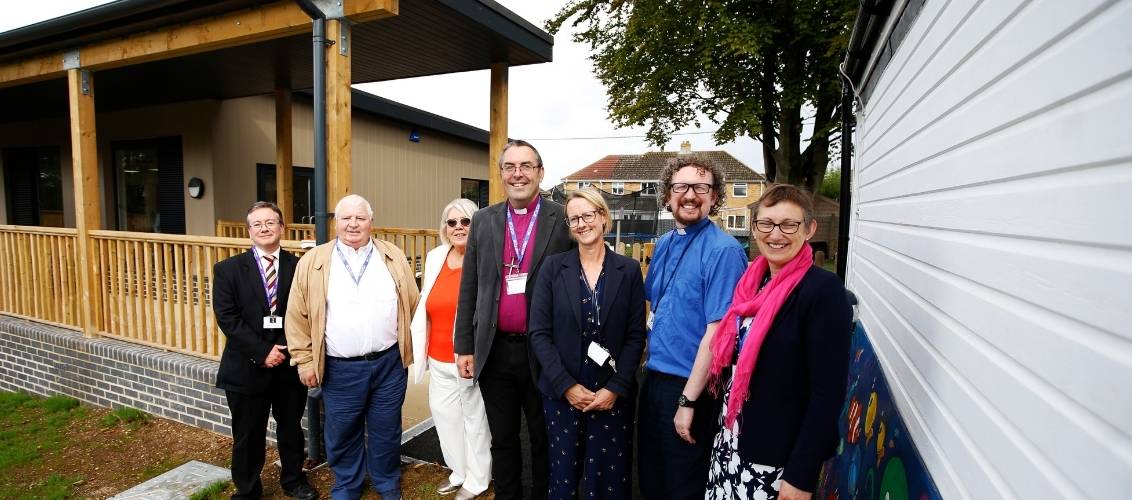 Bishop Gavin and St Nics CE Primary School leaders outside the new early years building