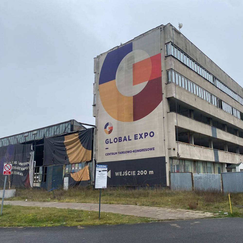 Warehouse in Warsaw in Poland with large multicoloured logo and sign on the side of the building reading "Global Expo"