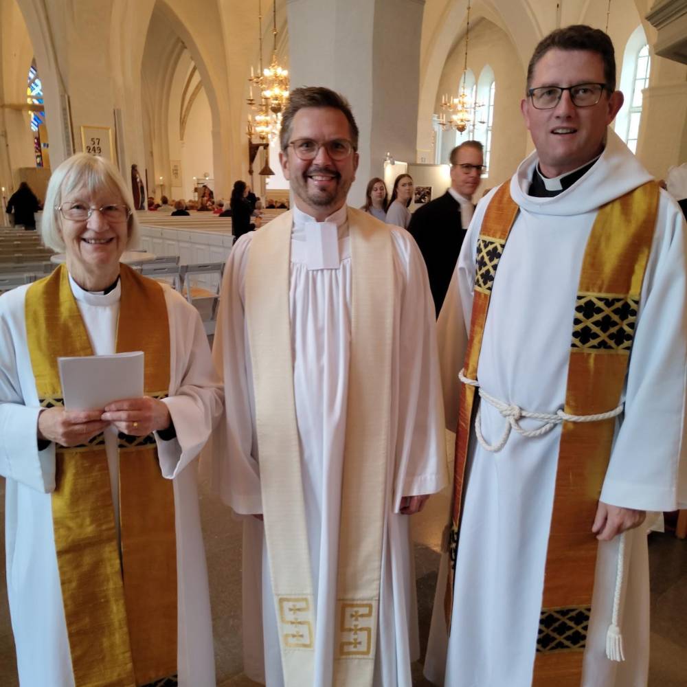 The Ven Christine Allsop and the Revd Canon Richard Lamey with a priest in a church in the link diocese in Sweden. 
