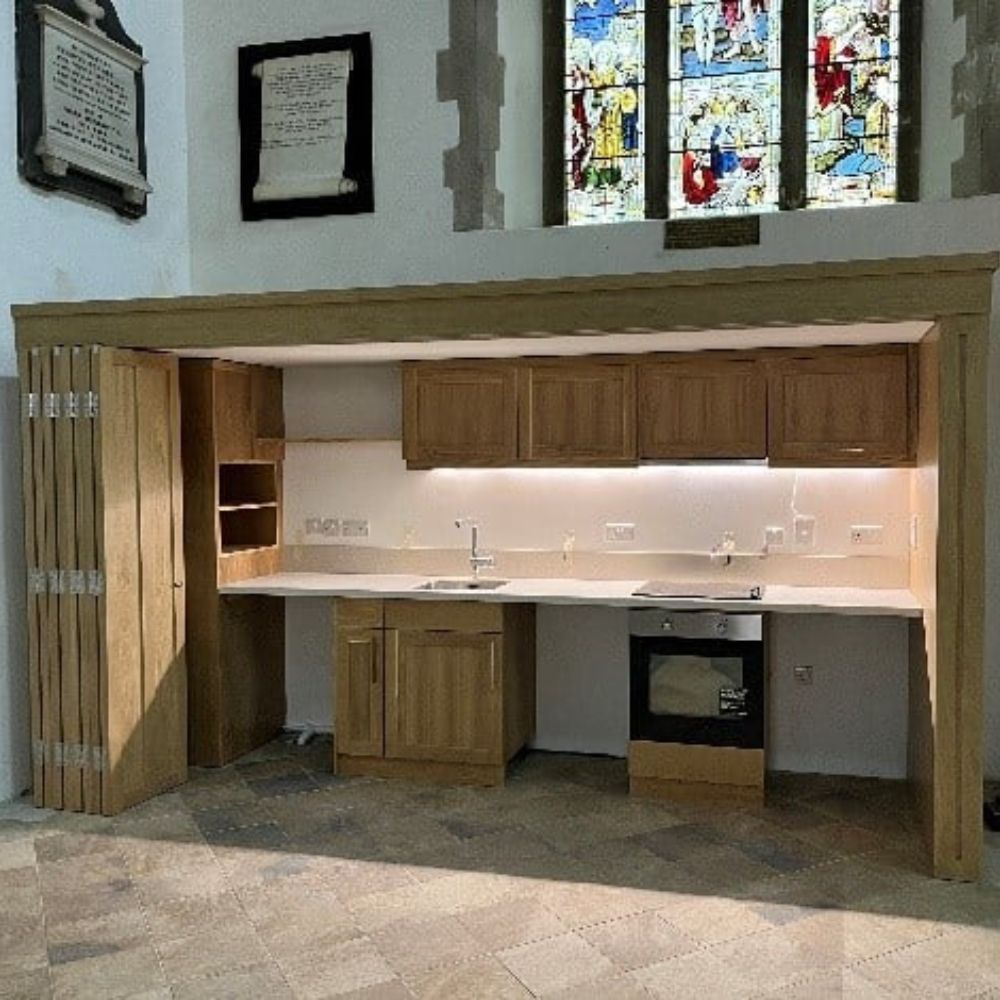 New kitchenette sitting below stained glass window in All Saints Church