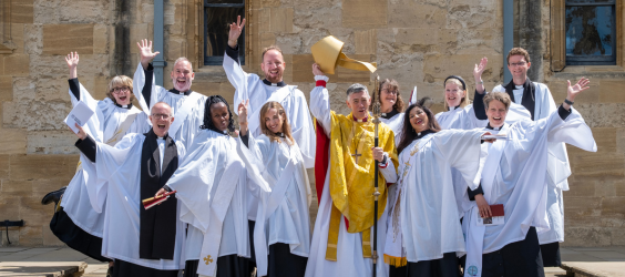 New deacons posing for a photo outside the church