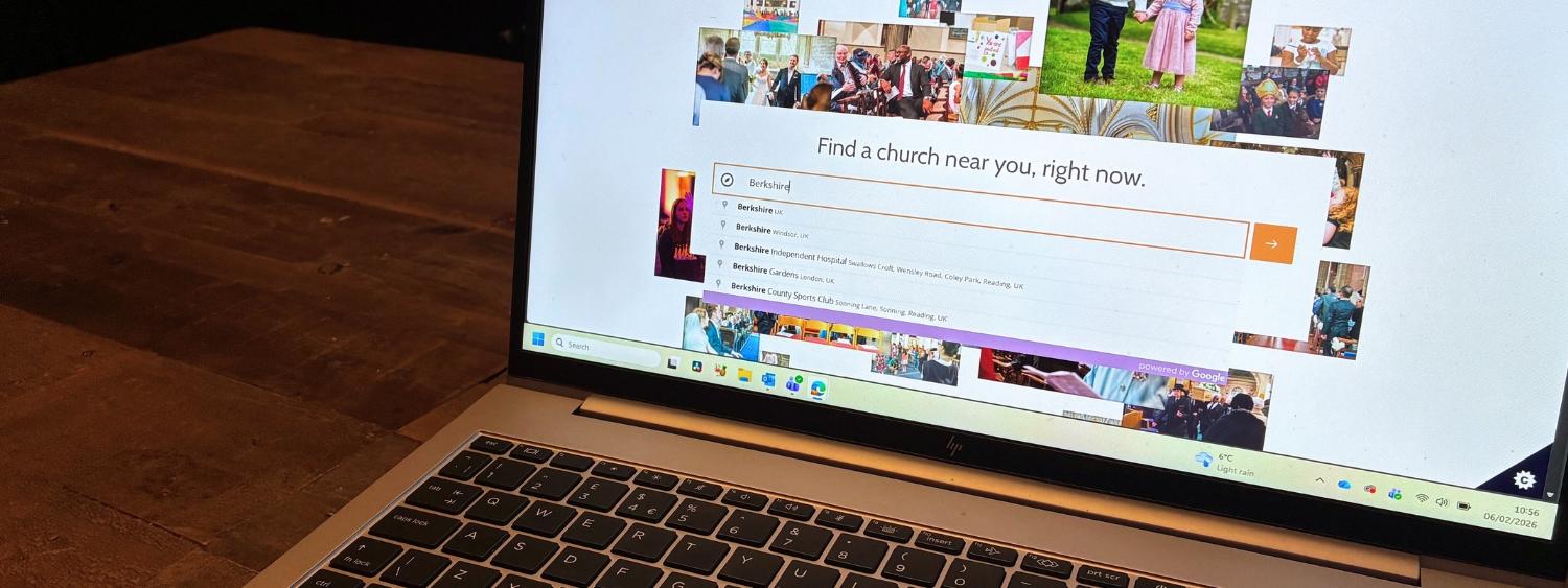 Photo of a laptop screen showing A Church Near You homepage
